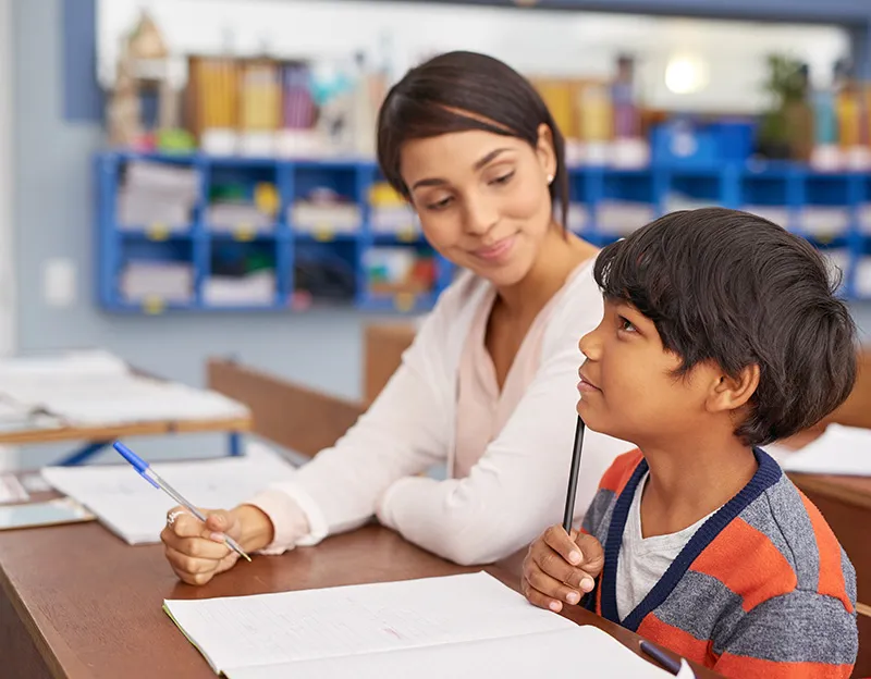 teacher helping student who is deep in thought