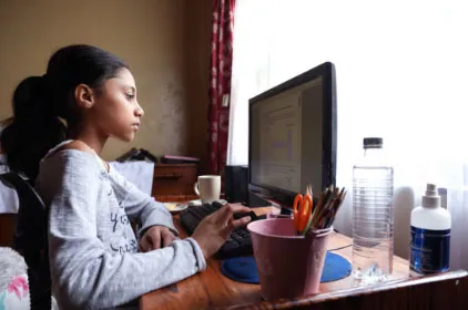 Girl at computer window