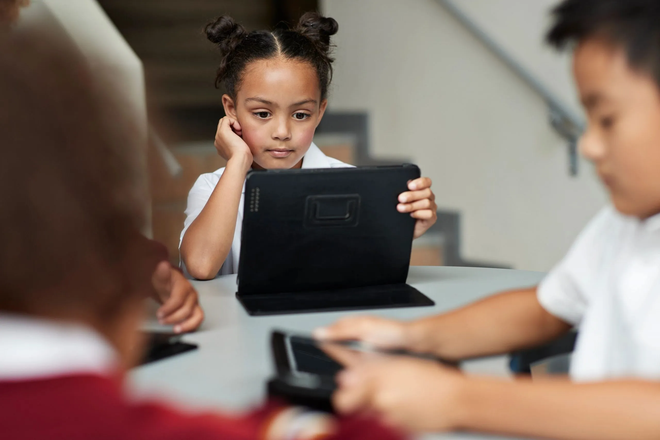 students on tablets