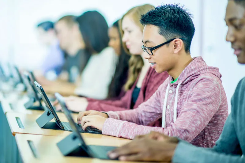 Class of students on computers