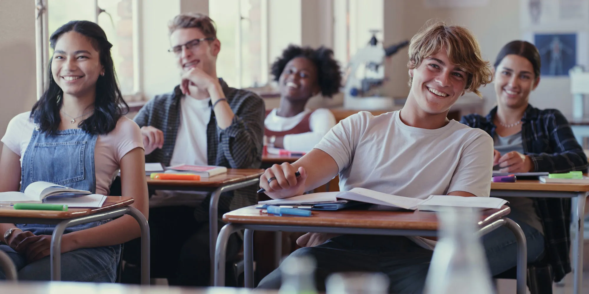 older students laughing in a classroom