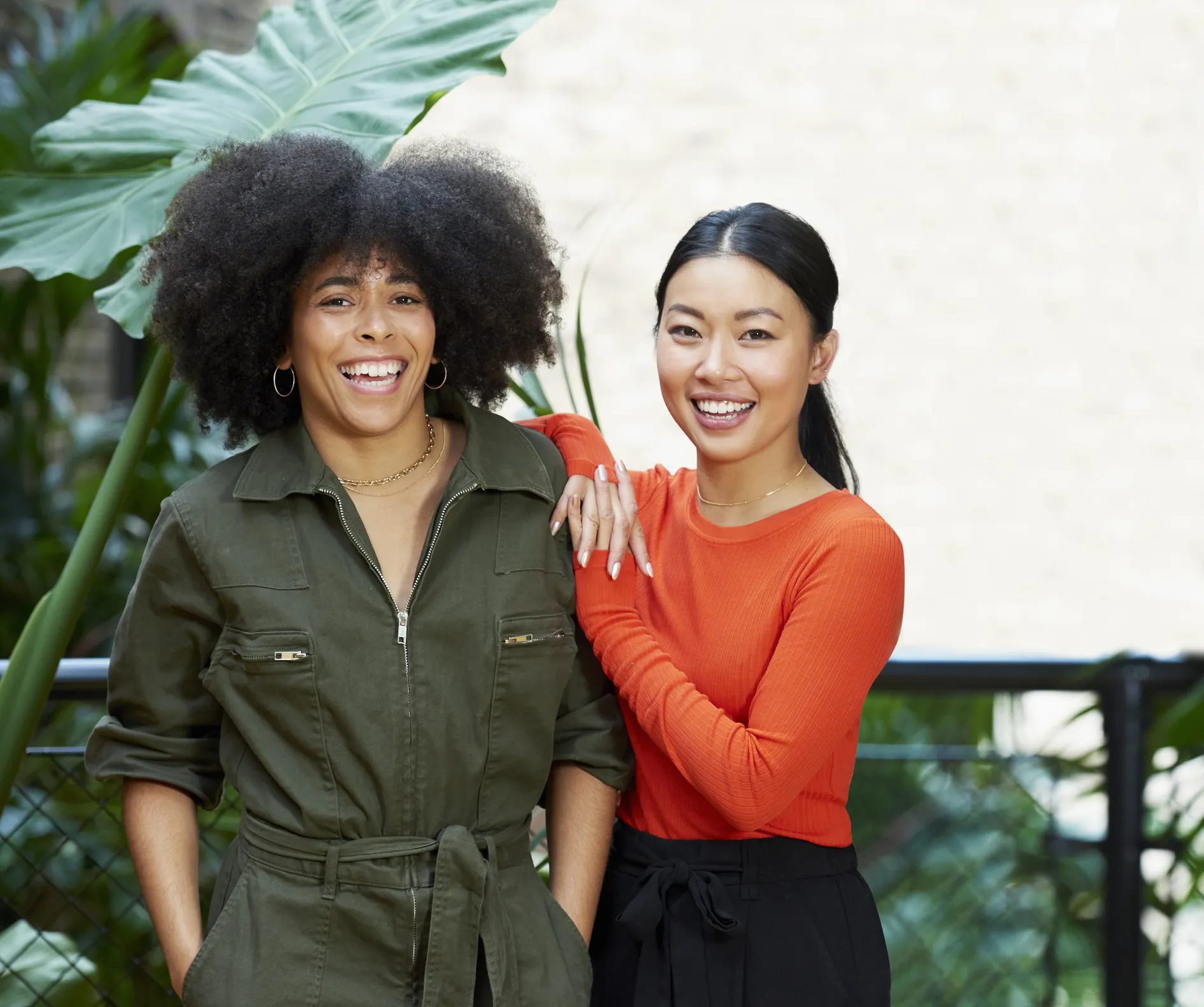 portrait of two young women smiling to camera