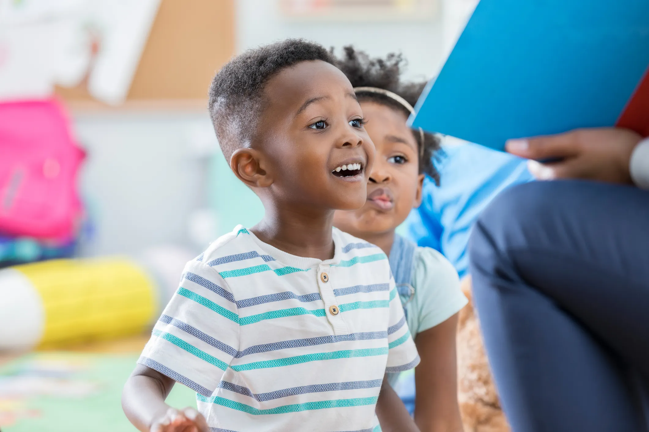 teacher reading to young students