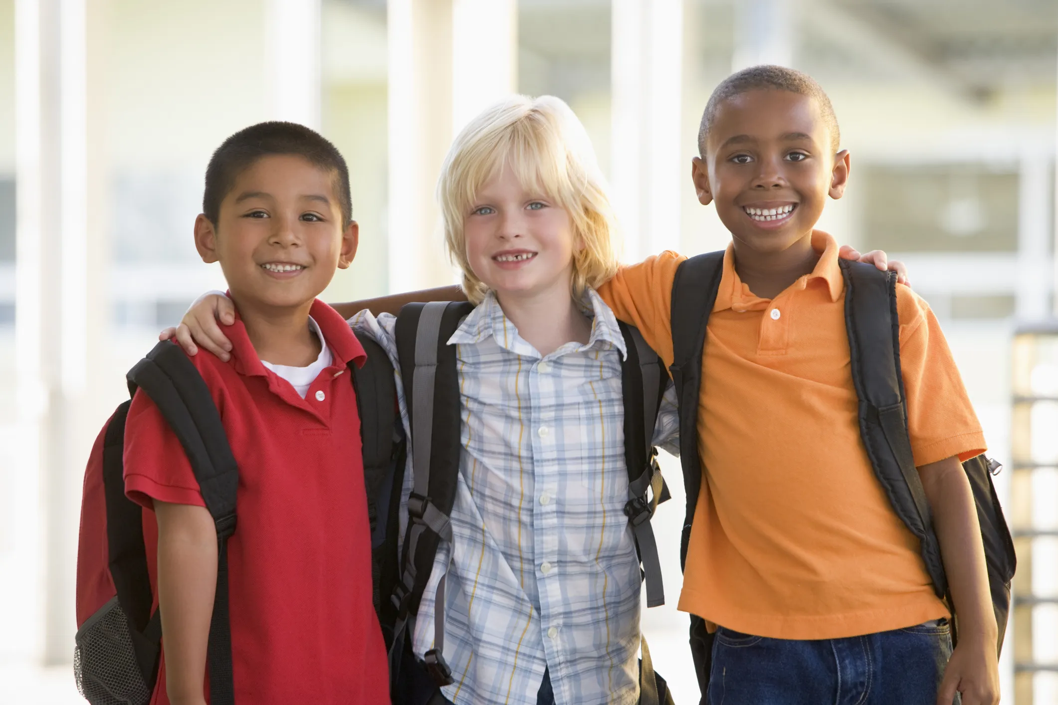 Three kindergarten boys standing together