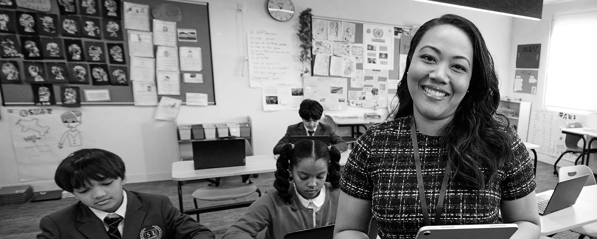 A teacher in her classroom with her students