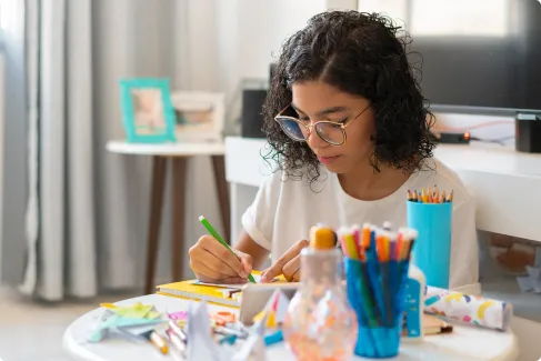 student painting at home