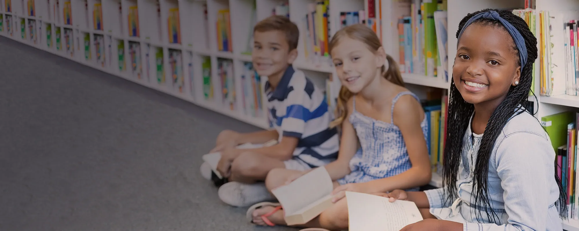 Children reading in a library