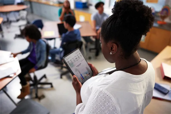 A teacher using Renaissance reports on a tablet computer