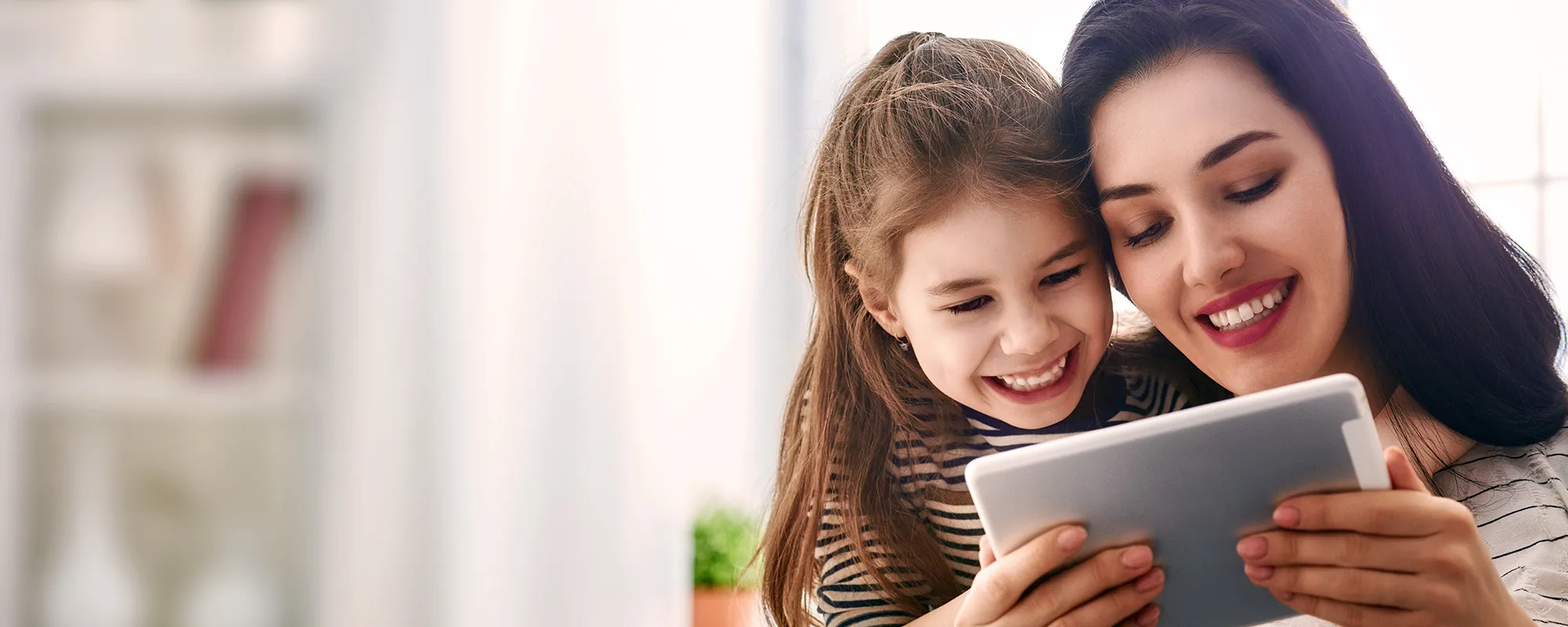 Parent and child using myON at home on a tablet